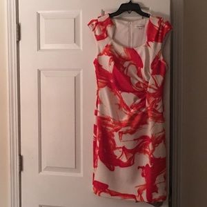 Orange and white knee length dress with rouching